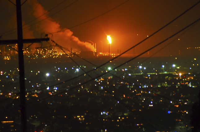 Flames are seen at the Chevron Richmond Refinery during the evening hours Dec.18, 2014 in Richmond. (Chris Treadway/Bay Area News Group)